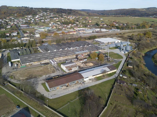 Strzyzow, Poland - 9 9 2018: View of the factory and residential area for workers with low multi-storey houses. Panorama from the drone or quadrocopter with a bird\'s-eye view. Architectural layout of the city.