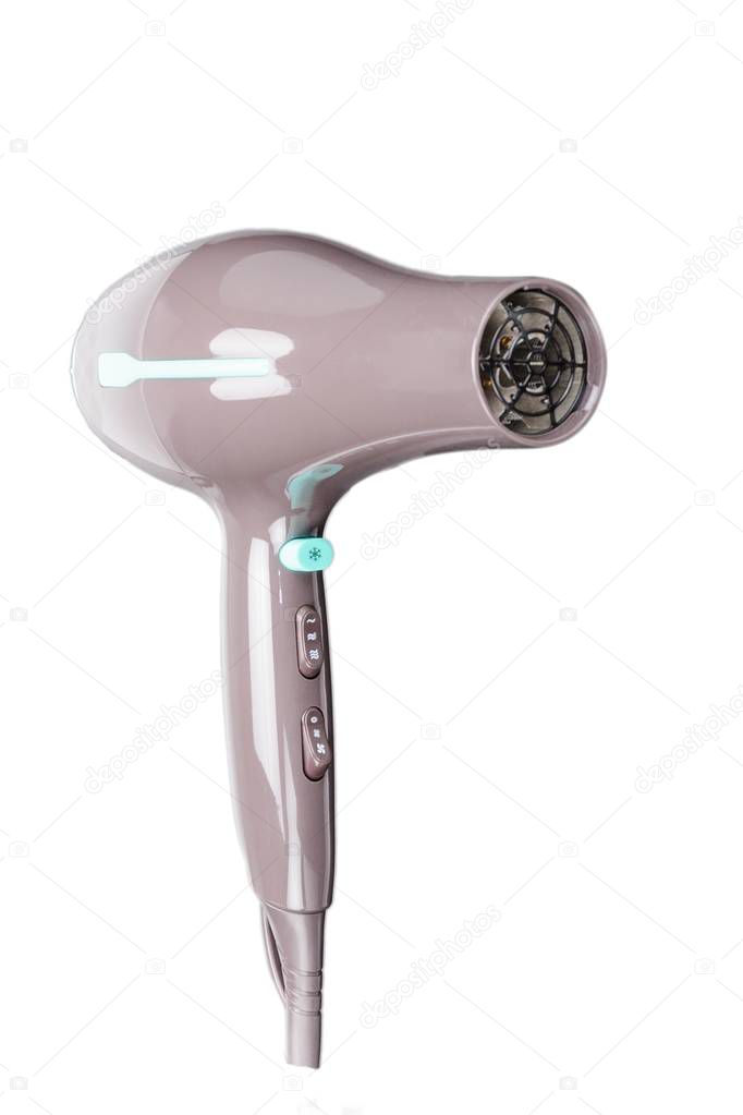 Brown hair dryer with green elements isolated on the white backg