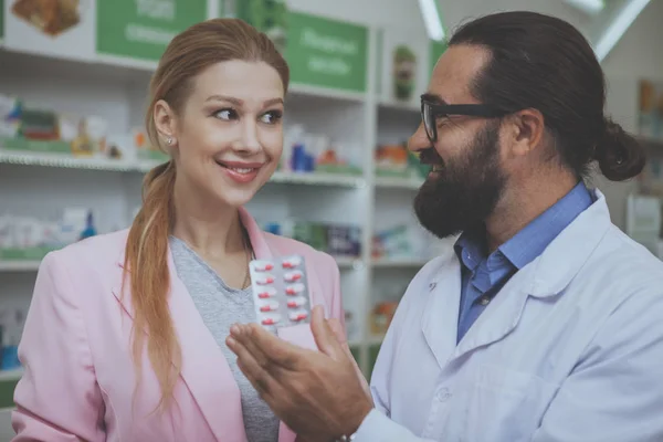 Lovely Young Woman Smiling Buying Pills Drugstore Bearded Mature Pharmacist — Stock Photo, Image