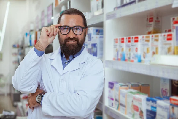 Friendly Mature Male Pharmacist Smiling Camera Putting His Glasses Working — Stock Photo, Image