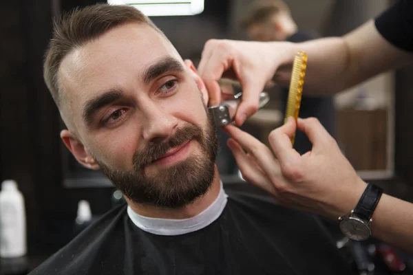 Handsome Man Smiling While Barber Trimming His Beard — Stock Photo, Image