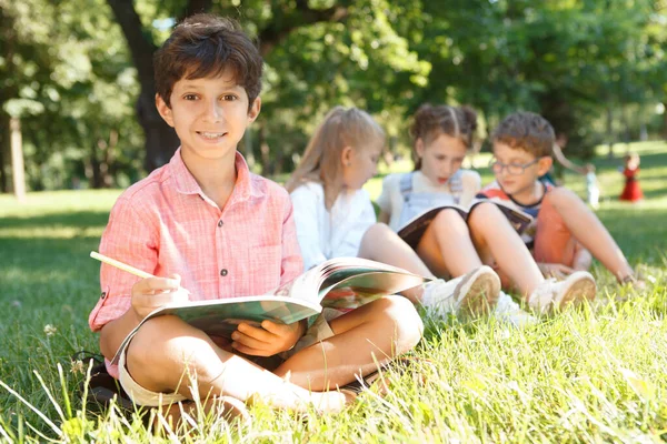 Happy Charming Little Boy Smiling Camera While Studying Outdoors His — Stock Photo, Image