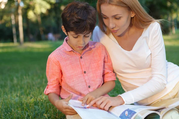 Close Cute Little Boy His Female Teacher Reading Book Outdoors — Stock Photo, Image