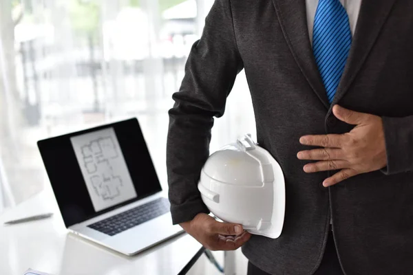 Photo Engineer in Suit in office on working day