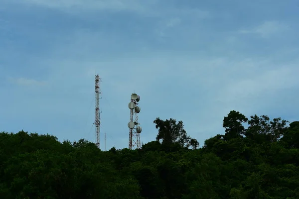 Cell phone atenna Satellite higth above tower.Telephone tower, communication tower antenna with blue sky and clouds.