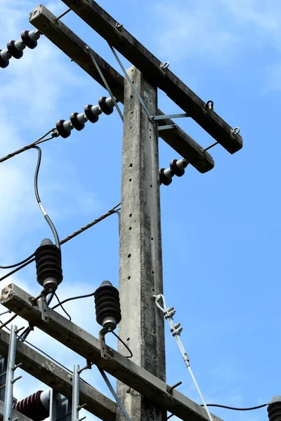 High voltage transmission line.high voltage pole Power transmission system With sky background image. High-voltage tower at blue sky background