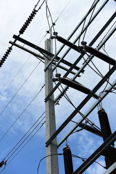 High voltage transmission line.high voltage pole Power transmission system With sky background image. High-voltage tower at blue sky background