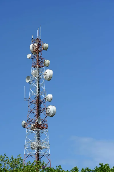 Microwave system.Wireless Communication Antenna With bright sky.Telecommunication tower with antennas with blue sky.