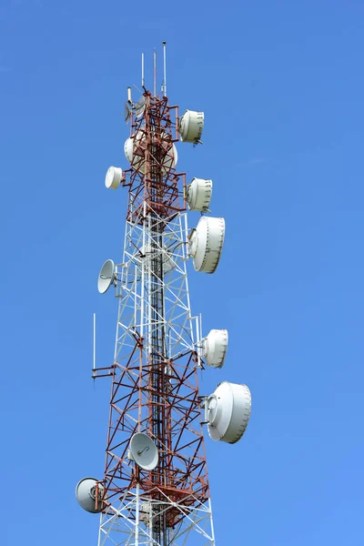 Microwave system.Wireless Communication Antenna With bright sky.Telecommunication tower with antennas with blue sky.