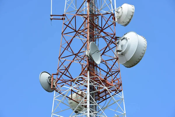 Microwave system.Wireless Communication Antenna With bright sky.Telecommunication tower with antennas with blue sky.