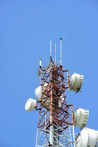 Microwave system.Wireless Communication Antenna With bright sky.Telecommunication tower with antennas with blue sky.