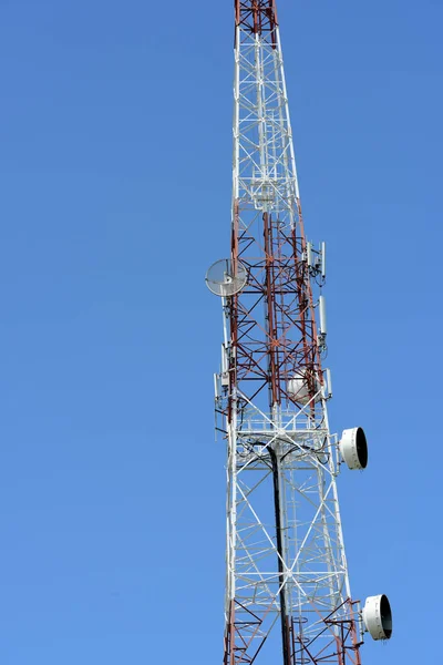 Microwave system.Wireless Communication Antenna With bright sky.Telecommunication tower with antennas with blue sky.