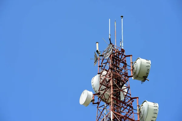 Microwave system.Wireless Communication Antenna With bright sky.Telecommunication tower with antennas with blue sky.