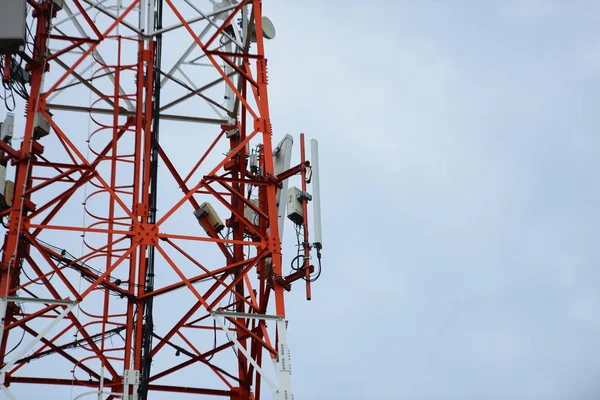 Microwave system.Wireless Communication Antenna With bright sky.Telecommunication tower with antennas with blue sky.