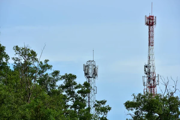 Wireless Communication Antenna With bright sky.Telecommunication tower with antennas with blue sky.