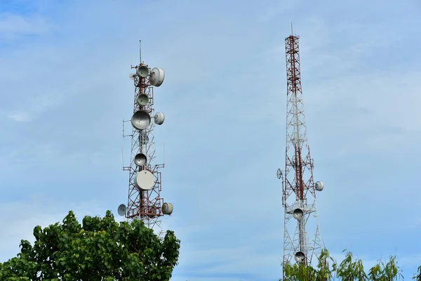 Wireless Communication Antenna With bright sky.Telecommunication tower with antennas with blue sky.