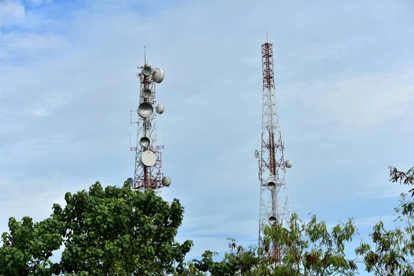 Wireless Communication Antenna With bright sky.Telecommunication tower with antennas with blue sky.