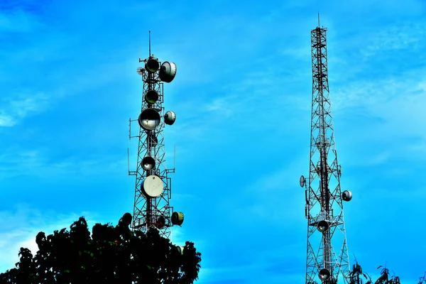 Wireless Communication Antenna With bright sky.Telecommunication tower with antennas with blue sky.