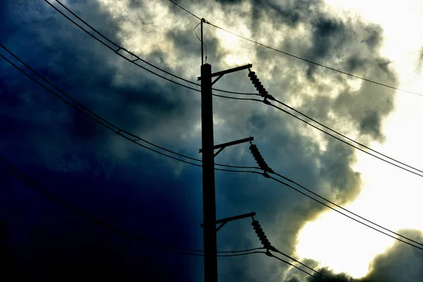 High voltage transmission line.high voltage pole Power transmission system With sky background image. High-voltage tower at blue sky