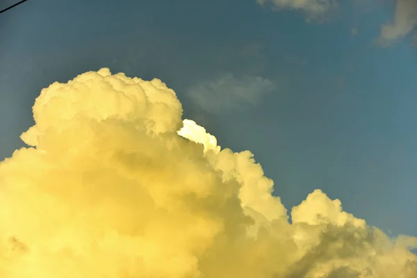 Beautiful sky, beautiful golden clouds in the sunset. Use as background image.Blue sky with beautiful clouds. In bright day, use as background image.