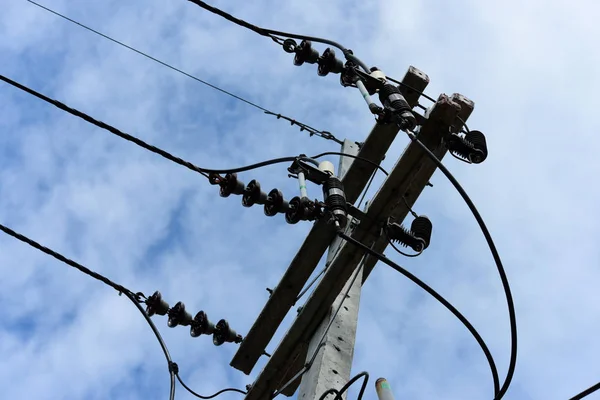 High voltage transmission line.high voltage pole Power transmission system With sky background image. High-voltage tower at blue sky