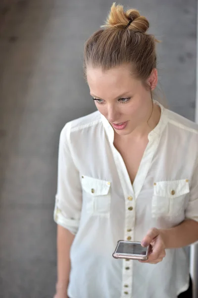 Business Woman Use Smartphone and Talk on the Busy Big City Street.