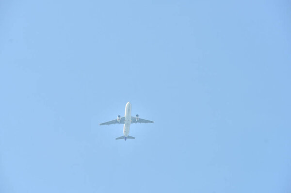 Airplane flying in the blue sky 