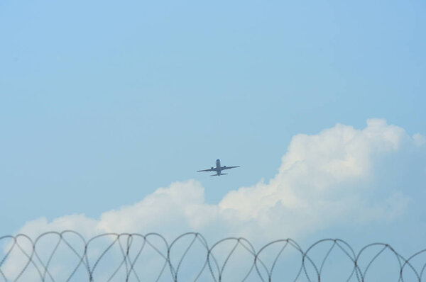 Airplane flying in the blue sky 