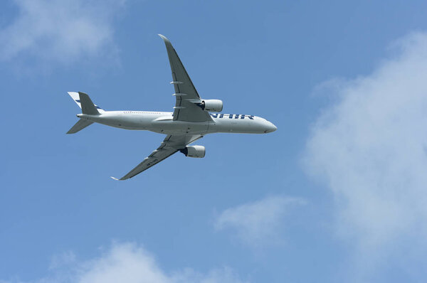 Airplane flying in the blue sky 