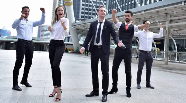 Group of business team posing in city downtown