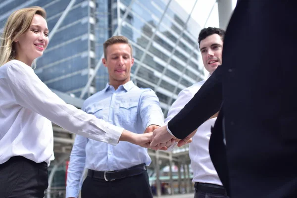 Group of business team posing in city downtown