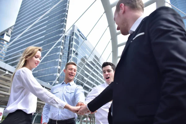 Group of business team posing in city downtown