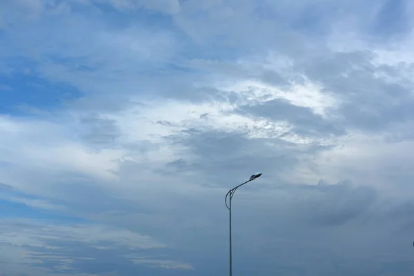 Road lamp on sky background
