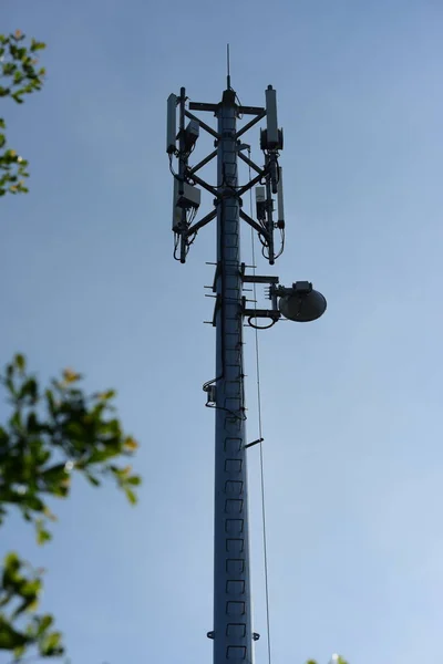 Wireless Communication Antenna With bright sky.Telecommunication tower with antennas with blue sky.