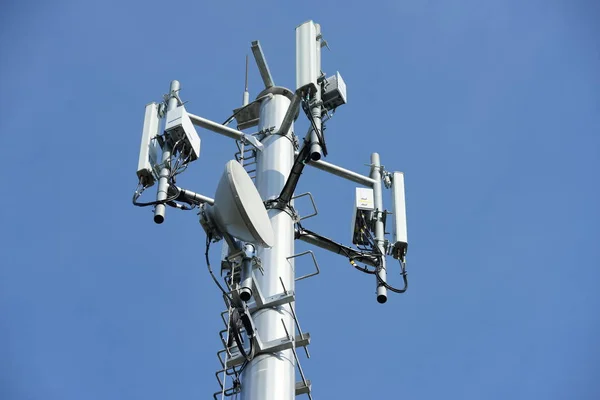 Wireless Communication Antenna With bright sky.Telecommunication tower with antennas with blue sky.