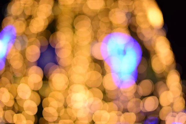 abstract blurred of blue and silver glittering shine bulbs lights background:blur of Christmas wallpaper decorations concept.christmas light night,abstract circular bokeh background