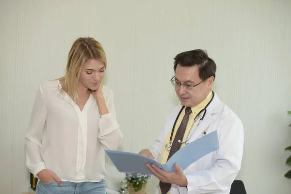 Doctor is talking with woman patient