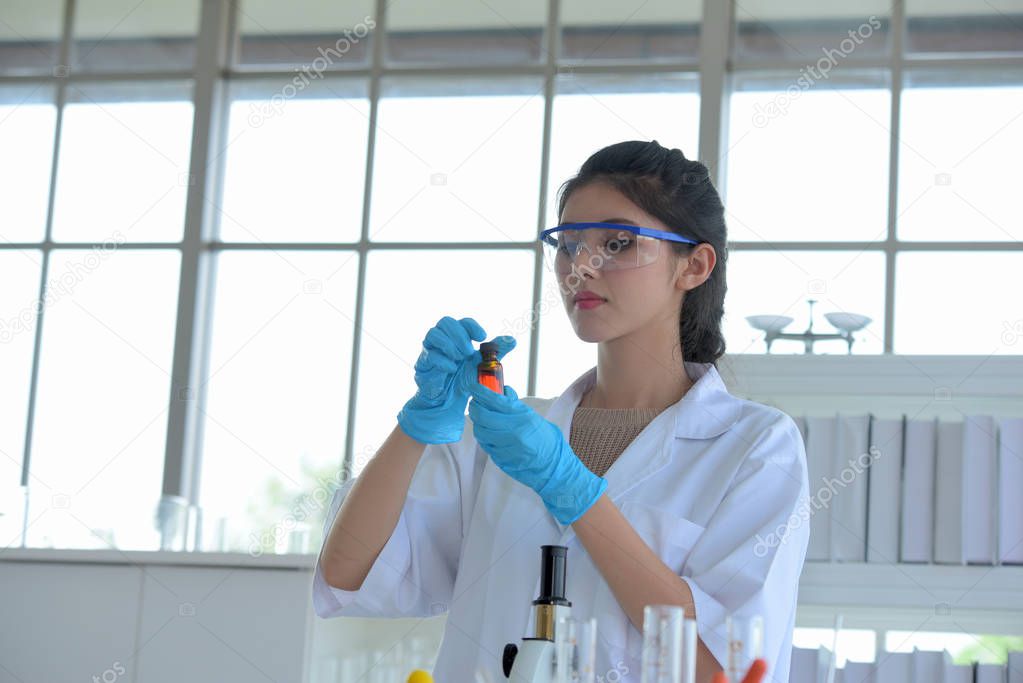 Female scientist is working in laboratory