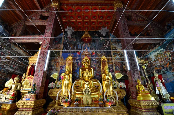 Old golden buddhist temple in Bangkok, Thailand.shrine inside of a buddhist temple.A beautiful temple with clear sky in Thailand. Temple was built in many years ago with unique Thai style.