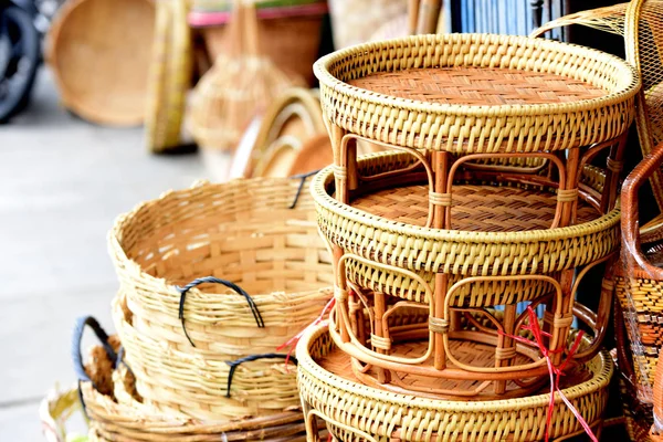 Rattan or bamboo handicraft hand made from natural straw basket.Basket wicker is Thai handmade. it is woven bamboo texture for background and design.Traditional Thai woven straw texture