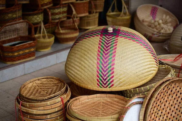 Wicker market.Rattan basket.Rattan or bamboo handicraft hand made from natural straw basket.Basket wicker is Thai handmade. it is woven bamboo texture for background and design.Traditional Thai woven straw texture