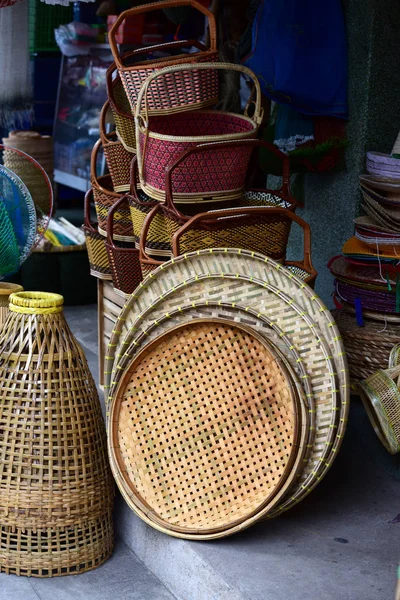 Wicker market.Rattan basket.Rattan or bamboo handicraft hand made from natural straw basket.Basket wicker is Thai handmade. it is woven bamboo texture for background and design.Traditional Thai woven straw texture