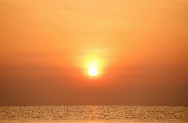 rising sun view and beach. Beautiful golden yellow sky and sun