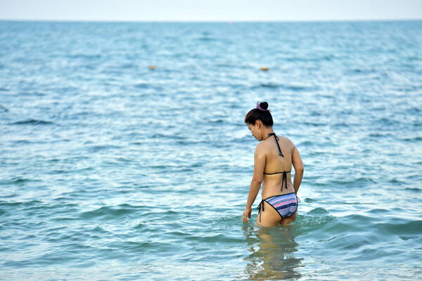 Thailand - 17 April, 2019: Asian woman swimming in sea