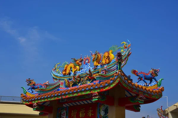 Chinese art shrine in Thailand. Chinese dragon statues on roof. Chinese decoration