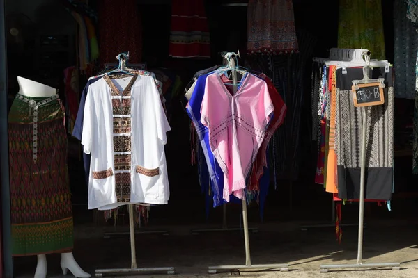 Variety of clothes on market in Thailand.
