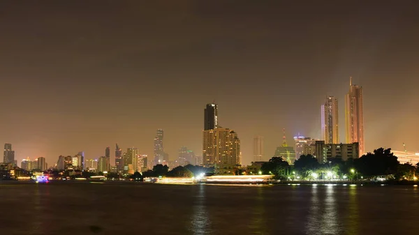 stock image view of city skyline lighting at nighttime