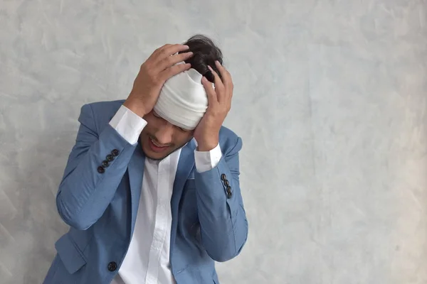 Overworked Businessman Bandaged Hurt Head Workplace Scattered Documents — Stock Photo, Image