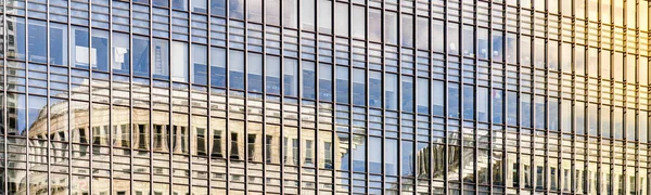 modern glass building with reflections