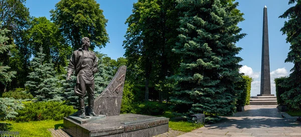 Kyiv, Ukraine 3d June,2025, Historic monument and obelisk at Park of Eternal Glory in Kyiv, Ukraine, commemorating fallen soldiers, set among lush greenery, pathways, and bright blue sky